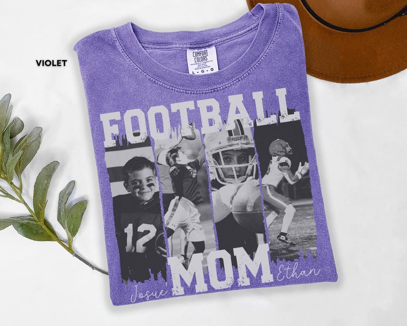 May include: A violet Comfort Colors t-shirt with a football theme. The shirt features the word "FOOTBALL MOM" in white block letters, along with black and white photos of football players. The names "Josue" and "Ethan" are written in script.