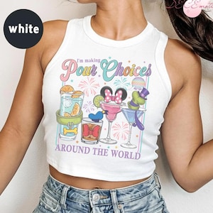 May include: White vest top featuring a vibrant cocktail-themed graphic with the text "I'm making Pour Choices Around The World." The design includes cartoon characters and cocktail glasses with various garnishes.