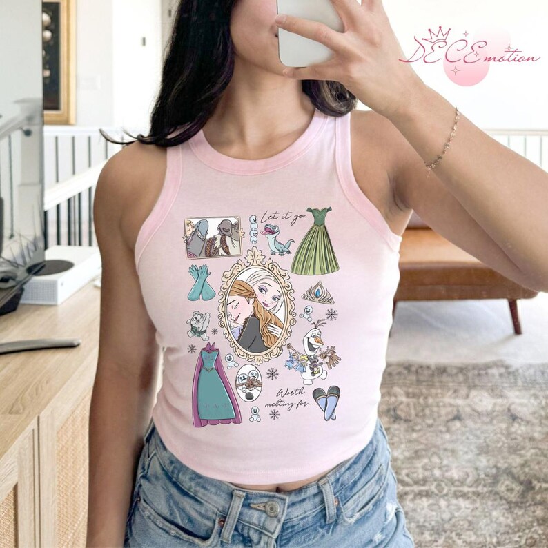 May include: Pink tank top with a light pink trim featuring a collage of Frozen-themed illustrations. The design includes images of Elsa and Anna, dresses, snowflakes, and the text "Let it go" and "Worth melting for."
