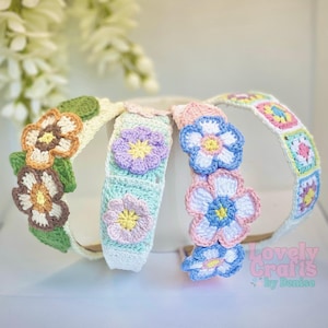 May include: Four handmade crochet headbands with floral designs. The headbands feature various colors, including white, green, brown, blue, pink, and yellow. One headband has a patchwork design. The text "Lovely Crafts by Denise" is visible.