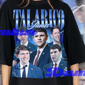 May include: Black oversized t-shirt featuring a graphic of several men in suits, with the name "Talarico James" in blue text. The background has a blue and white lightning design.