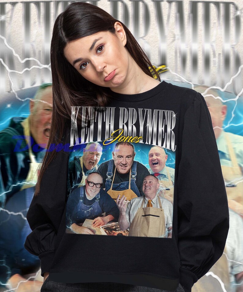 May include: Black sweatshirt featuring a graphic of Keith Brymer Jones and the text "Keith Brymer Jones". The graphic includes multiple images of the person. The background has a blue and white lightning design.
