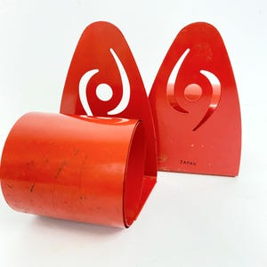 Suportes para livros de bobina de metal MCM vintage | Par de suportes para livros Tomy Red Atomic dos anos 1950