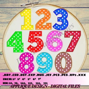 May include: A set of ten colorful, polka-dotted numbers, 1 through 10, in a hoop. The numbers are outlined in black and have white polka dots. The numbers are approximately 2 to 7 inches in size.