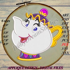May include: A white teapot with a yellow handle and a purple and yellow crown. The teapot has a smiling face with pink lips and large blue eyes. The teapot is on a brown background with the text "Dolly DreamStitches" and "APPLIQUE DESIGN - DIGITAL FILES".
