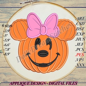 May include: An orange pumpkin design with a pink bow and black facial features, resembling a cartoon character. The design is on a white fabric stretched within an embroidery hoop. Text includes "6 sizes" and measurements in inches, along with file type abbreviations. The text "APPLIQUE DESIGN - DIGITAL FILES" is also present.
