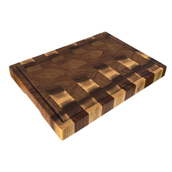 A serious end-grain walnut butcher block — the kind serious home cooks drool over — with optional personalization that elevates it from tool to trophy.