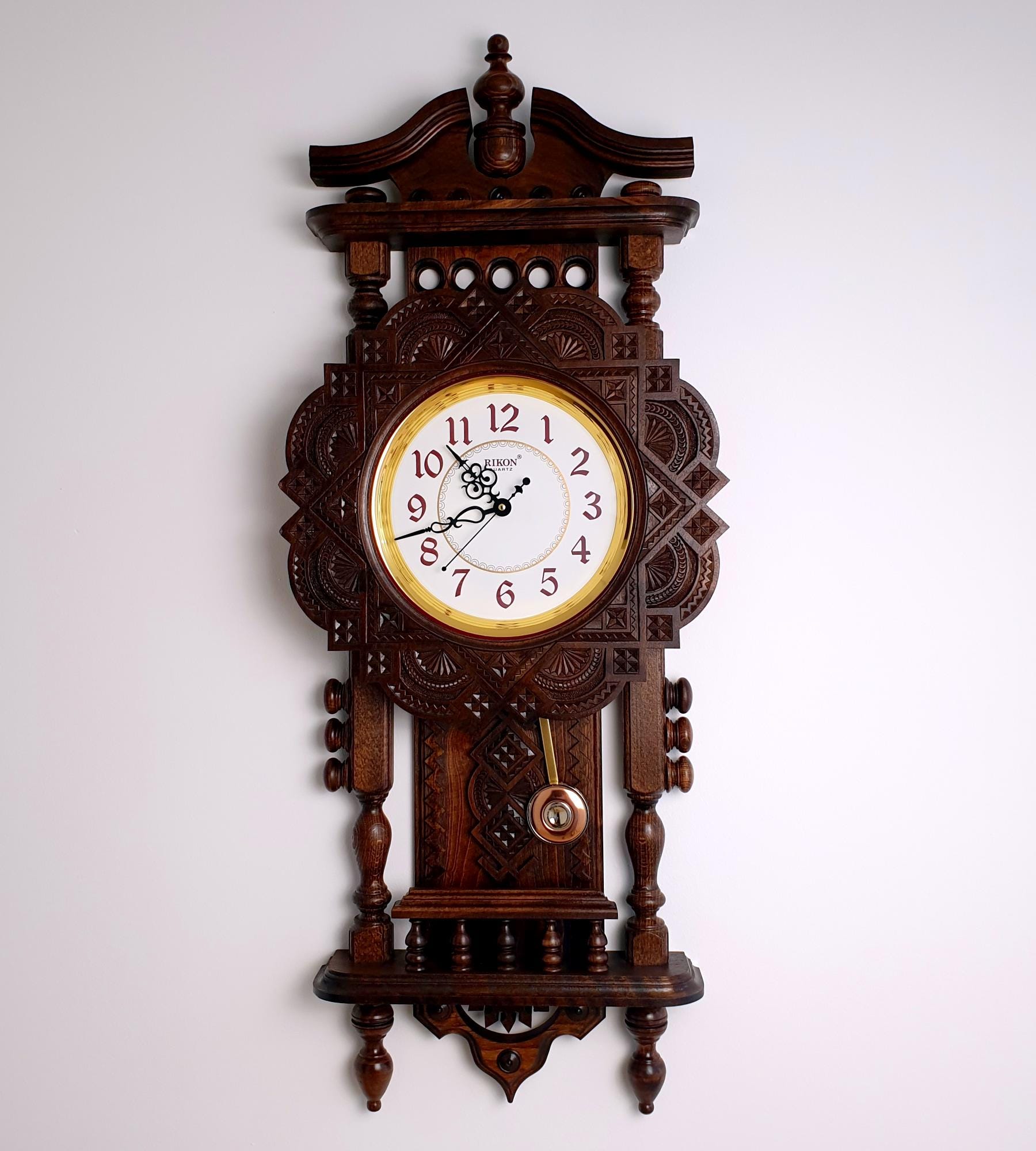 Exclusive handmade wooden wall clock decorated with original artistic carving. Unique wooden functional home decor.Original gift