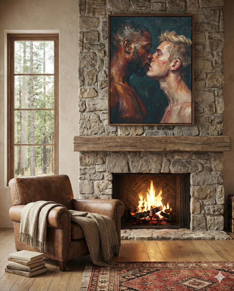 May include: A framed painting depicts two men kissing, displayed above a stone fireplace with a burning fire. A brown leather armchair with a blanket sits nearby. The room has a rustic, cozy atmosphere, with a window offering a view of trees.