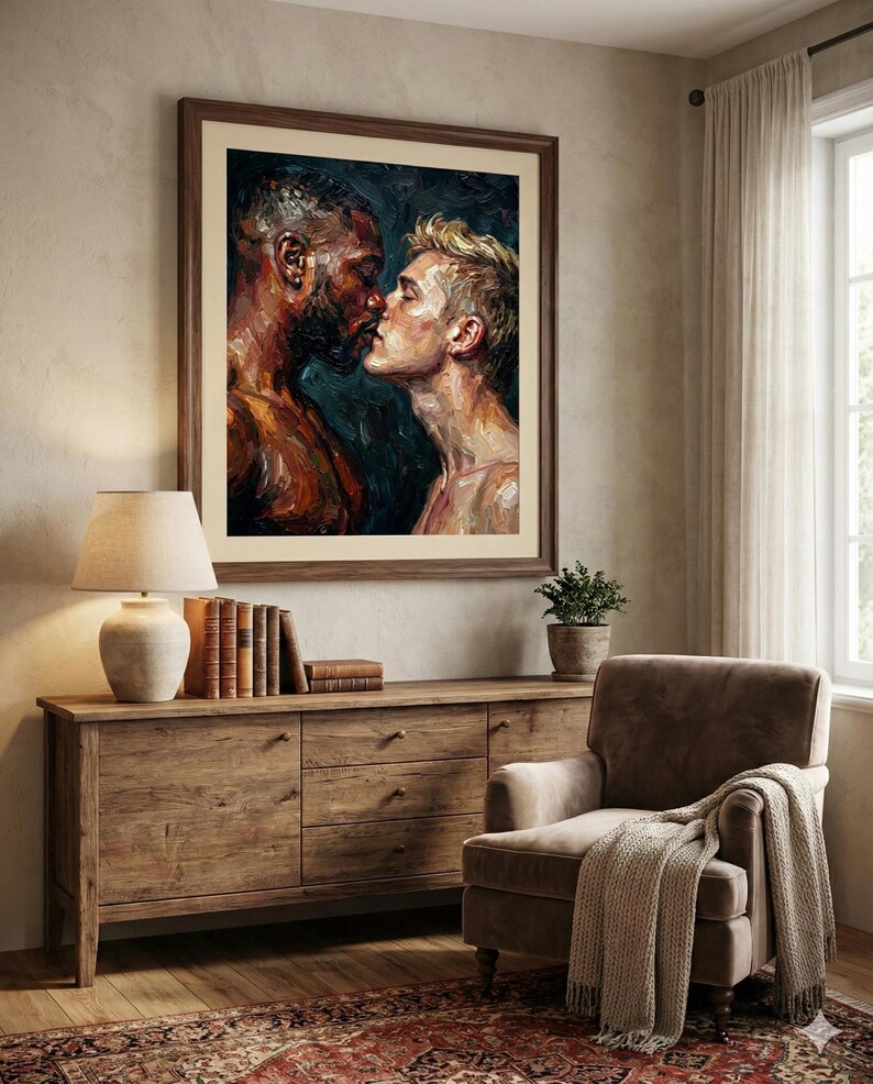 May include: A framed painting depicts two men in an intimate embrace, their faces close together. The artwork uses a palette of dark blues, browns, and creams, creating a warm and emotional atmosphere. The painting is displayed above a wooden cabinet.