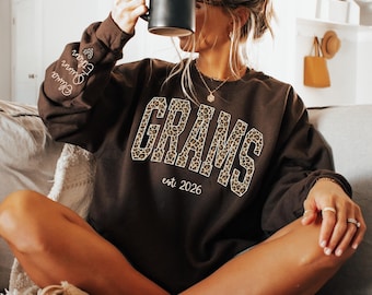 Custom Leopard Grams Sweatshirt With Kid Name On Sleeve, Personalized Grams Sweatshirt, Gift For Grams, Christmas Gift Grams Est Sweatshirt