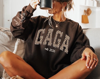 Custom Leopard Gaga Sweatshirt With Kid Name On Sleeve, Personalized Gaga Sweatshirt, Gift For Gaga, Christmas Gift Gaga Est 2025 Sweatshirt