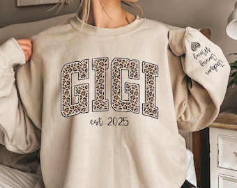 Custom Leopard Gigi Sweatshirt With Kid Name On Sleeve, Personalized Gigi Sweatshirt, Gift For Gigi, Christmas Gift Gigi Est 2025 Sweatshirt