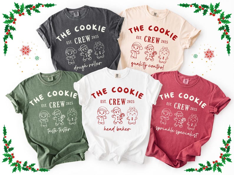 May include: Five t-shirts in various colors, each featuring the text "THE COOKIE CREW EST. 2025" with gingerbread person illustrations. The roles listed are dough roller, quality control, taste tester, head baker, and sprinkle specialist.