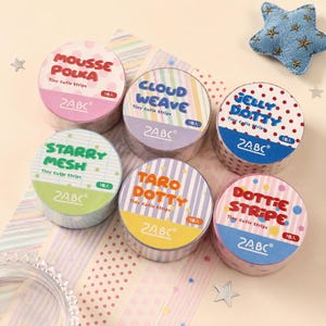 May include: Six rolls of ZABC brand decorative adhesive tape labeled Mousse Polka, Cloud Weave, Jelly Dotty, Starry Mesh, Taro Dotty, and Dottie Stripe. Each roll features distinct patterns including polka dots, stripes, and grids in various colors.