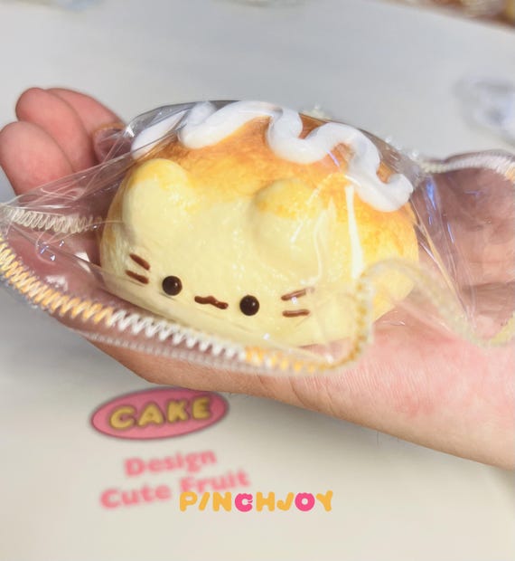 愛らしい猫パンのスクイーズおもちゃ、柔らかいパイナップルパンの
