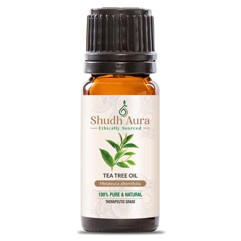 Puede incluir: Una botella de vidrio marr&oacute;n con una tapa negra, etiquetada "Shudh Aura Tea Tree Oil Melaleuca alternifolia 100% Puro & Natural Grado Terap&eacute;utico".