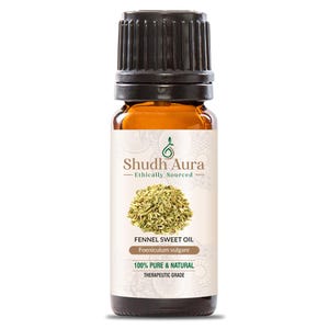 May include: A brown glass bottle of Shudh Aura Fennel Sweet Oil. The label includes the text "Ethically Sourced", "100% Pure & Natural", and "Therapeutic Grade". The bottle has a black cap and contains fennel seeds.