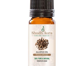 May include: A brown glass bottle with a black cap, labeled "Shudh Aura Ethically Sourced Allspice Oil Pimenta officinalis 100% PURE & NATURAL THERAPEUTIC GRADE". The bottle is filled with a dark brown liquid and has a small image of allspice berries on the label.