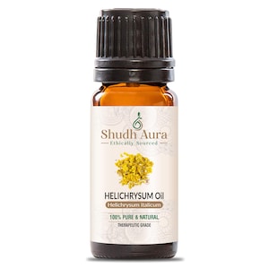 Peut inclure: Une bouteille en verre brun avec un bouchon noir, étiquetée "Helichrysum Oil" avec le texte "Shudh Aura Ethically Sourced" et "100% Pure & Natural Therapeutic Grade".