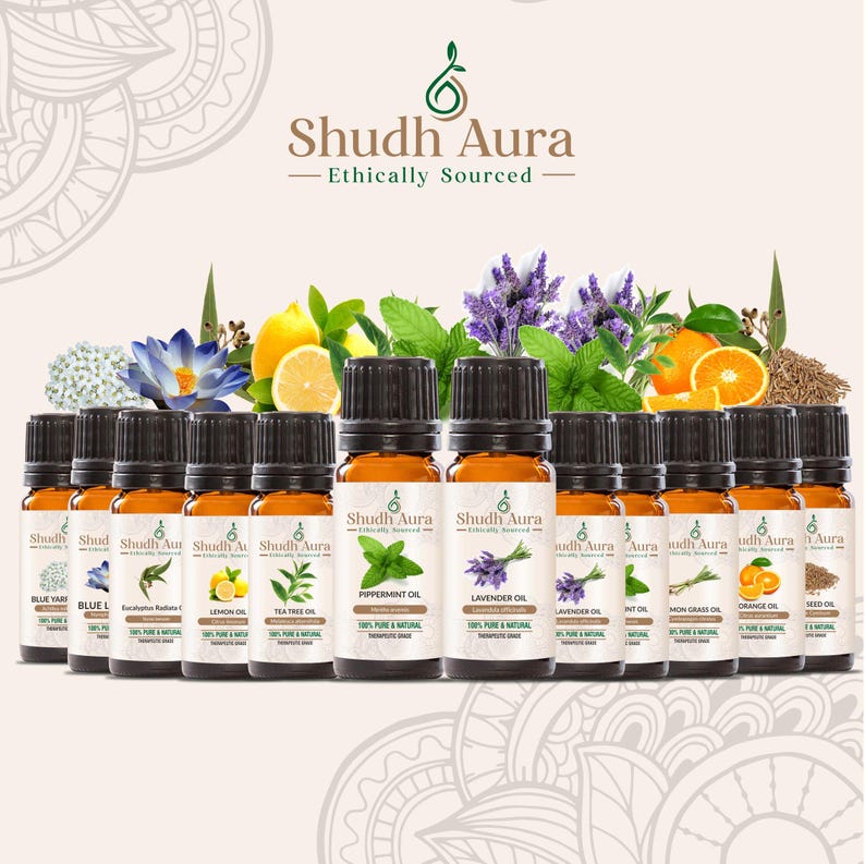 May include: A collection of 12 amber glass bottles with black caps, each containing a different essential oil. The bottles are labeled with the name of the oil, "Shudh Aura", and "Ethically Sourced".