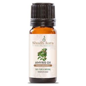 Może przedstawiać: Brązowa butelka szklana z czarną zakrętką, z etykietą "Shudh Aura Amyris Oil Amyris balsamifera 100% PURE & NATURAL THERAPEUTIC GRADE". Etykieta zawiera również ilustrację zielonego liścia.