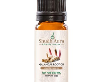 Könnte beinhalten: Eine braune Glasflasche mit Shudh Aura Galgantwurzelöl. Das Etikett enthält den Text "Ethically Sourced", "100% Pure & Natural" und "Therapeutic Grade". Die Flasche hat einen schwarzen Deckel und zeigt eine Illustration der Galgantwurzel.