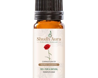 May include: A small amber glass bottle with a black cap, labelled "Shudh Aura - Ethically Sourced" and "Carnation Oil Dianthus caryophyllus 100% PURE & NATURAL THERAPEUTIC GRADE".