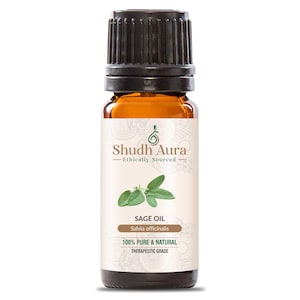May include: A small amber glass bottle with a black ribbed cap containing sage oil. The label features the text Shudh Aura, Ethically Sourced, SAGE OIL, Salvia officinalis, 100% PURE & NATURAL, and THERAPEUTIC GRADE with a green sage leaf graphic.