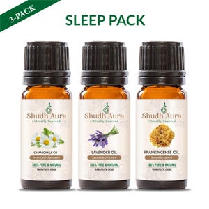 May include: Three amber glass essential oil bottles with black caps. The labels read "Shudh Aura" and list chamomile, lavender, and frankincense oils. The text "Sleep Pack" is at the top, and "3-PACK" is in the upper left corner.