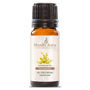 Può includere: Una bottiglia di vetro marrone con un tappo nero, etichettata "Shudh Aura - Ethically Sourced" e "Galbanum Oil - Ferula galbaniflua". L'etichetta riporta anche "100% Puro & Naturale" e "Grado Terapeutico".