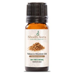 Peut inclure: Une bouteille en verre brun avec un bouchon noir, étiquetée "Tobacco Absolute Oil" avec le texte "Nicotiana tabacum, 100% PURE & NATURAL, THERAPEUTIC GRADE".
