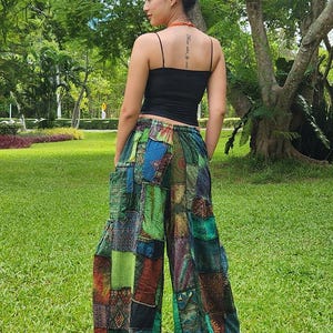 May include: Patchwork pants with a variety of colors and patterns, including green, blue, red, and brown. The pants have a wide leg and a loose fit.