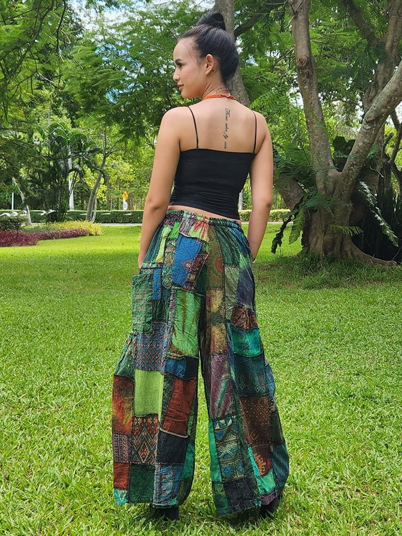 May include: Patchwork pants with a variety of colors and patterns, including green, blue, red, and brown. The pants have a wide leg and a loose fit.