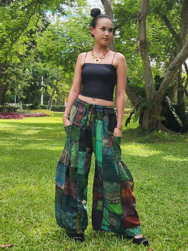 May include: Green, blue, and brown patchwork pants with a drawstring waist. The pants are wide-legged and have a relaxed fit.