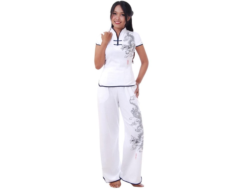 May include: White pants with a black dragon design and a white shirt with a black dragon design and a mandarin collar.