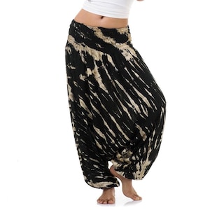 May include: Black and white tie-dye harem pants with a wide elastic waistband.