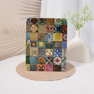 May include: A rectangular decorative plaque featuring a grid of forty-eight individual square tiles. Each tile displays a unique, colorful relief pattern, including floral motifs, sun faces, geometric shapes, and botanical designs in various shades.