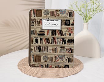 May include: A composition book with a beige cover featuring a repeating pattern of bookshelves filled with various books, globes, and vases. A white rectangular label in the center displays the text "COMPOSITION BOOK" and "Marasong".