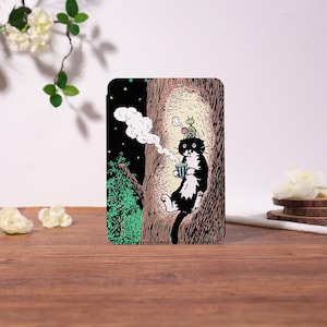 May include: A set of three ceramic mugs with a speckled, matte finish. The mugs are in shades of cream, light gray, and dark gray. Each mug has a simple, minimalist design and a rounded handle.