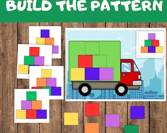 May include: A printable worksheet for children to build a pattern using coloured blocks. The worksheet shows a lorry with a stack of blocks in the back. Below the lorry are individual blocks in yellow, orange, red, purple, and green. The text "BUILD THE PATTERN" is at the top of the worksheet.