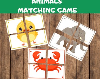 May include: A printable matching game for children featuring four different animals: a yellow chick, a grey elephant, a red crab, and a blue whale. The game is designed to help children learn about different animals and their names.