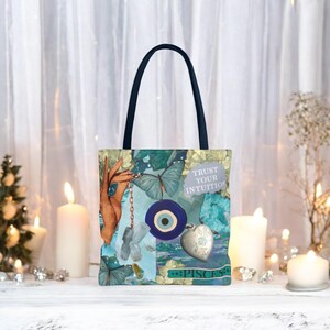 May include: A tote bag with a collage design featuring butterflies, an eye symbol, and the text "Trust Your Intuition." The bag has a dark blue handle and a Pisces zodiac sign. The color palette includes teal, blue, and gold.