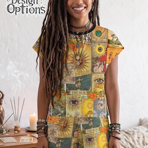 May include: A short-sleeve t-shirt and shorts set featuring an all-over print of various tarot card illustrations, including multiple depictions of the sun, eyes, and celestial motifs, with the text The Sun visible on several of the card designs.