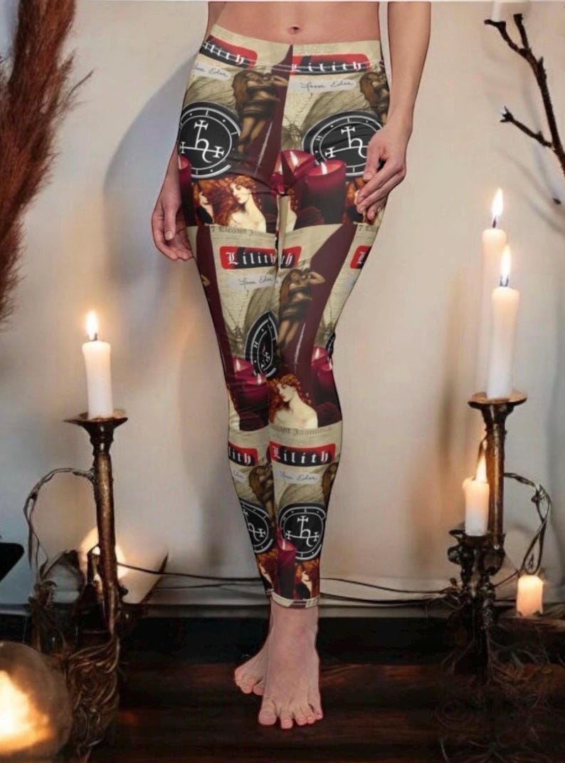 May include: High-waisted leggings featuring a repeating graphic print of the text Lilith, occult sigils, red candles, and a figure with long hair. The design incorporates a beige background with dark red and black accents throughout the fabric.