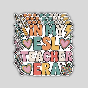 May include: A sticker with the text "IN MY ESL TEACHER ERA" in a retro font. The design includes a pencil, hearts, stars, a lightning bolt, and a colorful apple. The sticker has a white border and a gray background.
