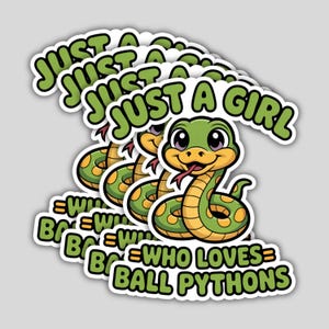 May include: A stack of stickers featuring a cartoon snake with a green body, yellow spots, and a red tongue. The text "JUST A GIRL WHO LOVES BALL PYTHONS" is in green and white.