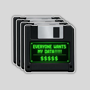 May include: A stack of black floppy disk stickers with a silver sliding cover. The green screen displays the text "EVERYONE WANTS MY DATA!!!!!" and dollar signs. The stickers have a white border.