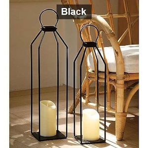 May include: A white ceramic mug with a black handle and the text "But First, Coffee" in a handwritten style. The mug is on a white surface. The mug is approximately 4 inches tall.