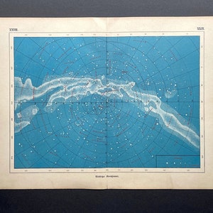 May include: An antique celestial map with a blue background, featuring a circular star chart. White and red lines and dots represent constellations and stars. The map is printed on aged paper with text at the top and bottom.